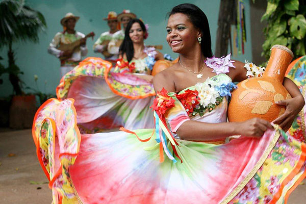 Dancers from the Siriri performance group, Grupo Flor Ribeirinha, demonstrate their colourful costumes and graceful flowing skirts.